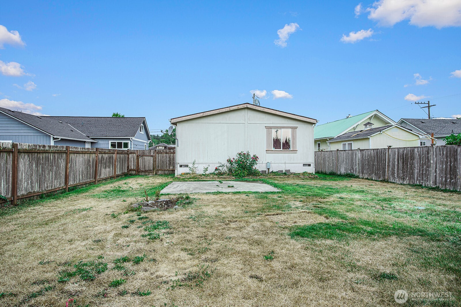124 South 6th Street McCleary, WA 98557 - Photo 26 of 33 a view of a house with backyard and wooden fence