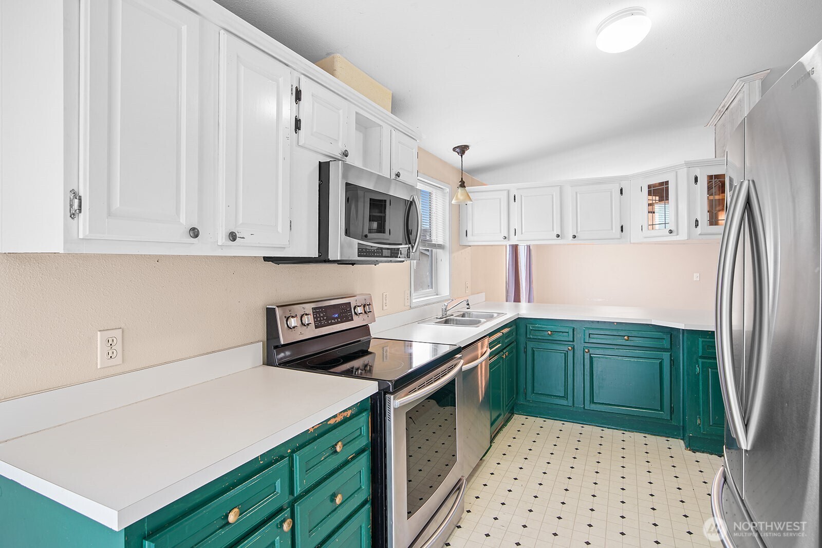 124 South 6th Street McCleary, WA 98557 - Photo 8 of 33 a kitchen with stainless steel appliances granite countertop a refrigerator sink and cabinets