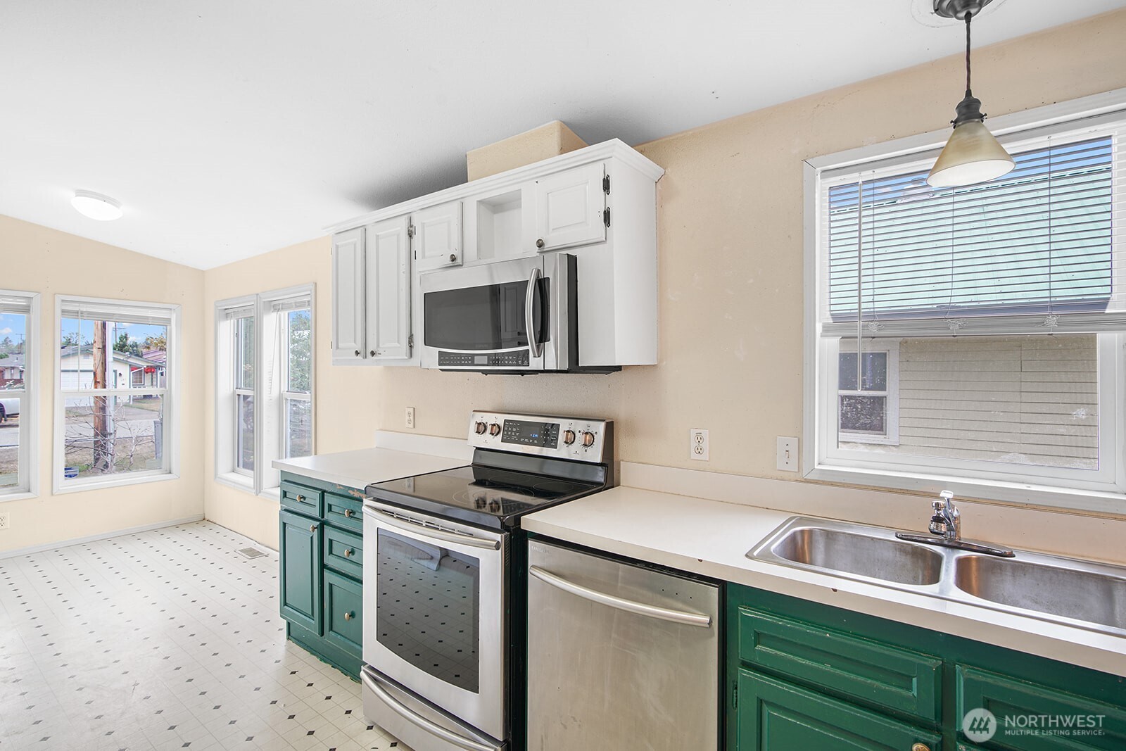 124 South 6th Street McCleary, WA 98557 - Photo 9 of 33 a kitchen with stainless steel appliances a sink stove and microwave