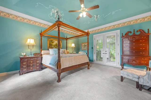 a bedroom with a bed window and a table