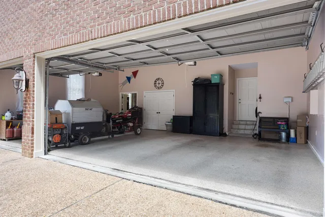 a view of a house with backyard and trees