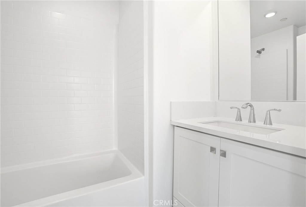3140 Cove Street Rancho Mission Viejo, CA 92694 - Photo 11 of 69 a bathroom with a granite countertop sink and a bathtub
