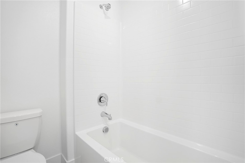 3140 Cove Street Rancho Mission Viejo, CA 92694 - Photo 12 of 69 a white bath tub sitting next to a white toilet
