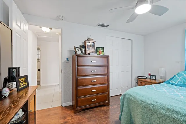 a bedroom with a bed and a dresser