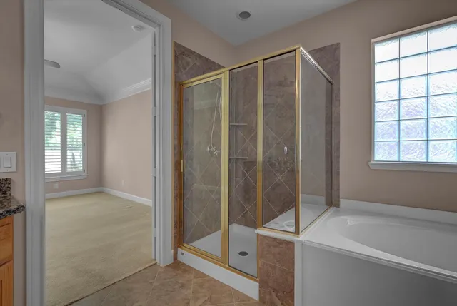 a bathroom with a shower and a sink