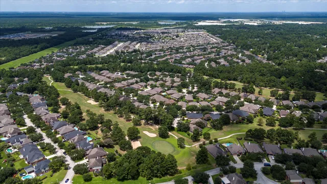 an aerial view of a city with lots of residential buildings