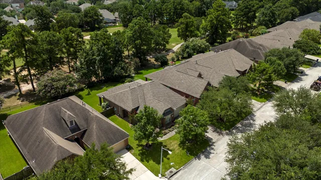 an aerial view of house with yard