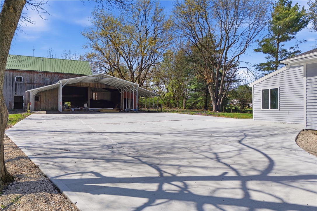 3190 Rebert Pike Springfield, OH 45502 - Photo 3 of 48 This spacious property offers ample paved area and versatile outbuildings for various needs.