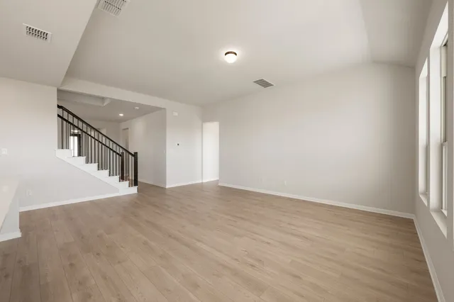 a view of kitchen with wooden floor and window