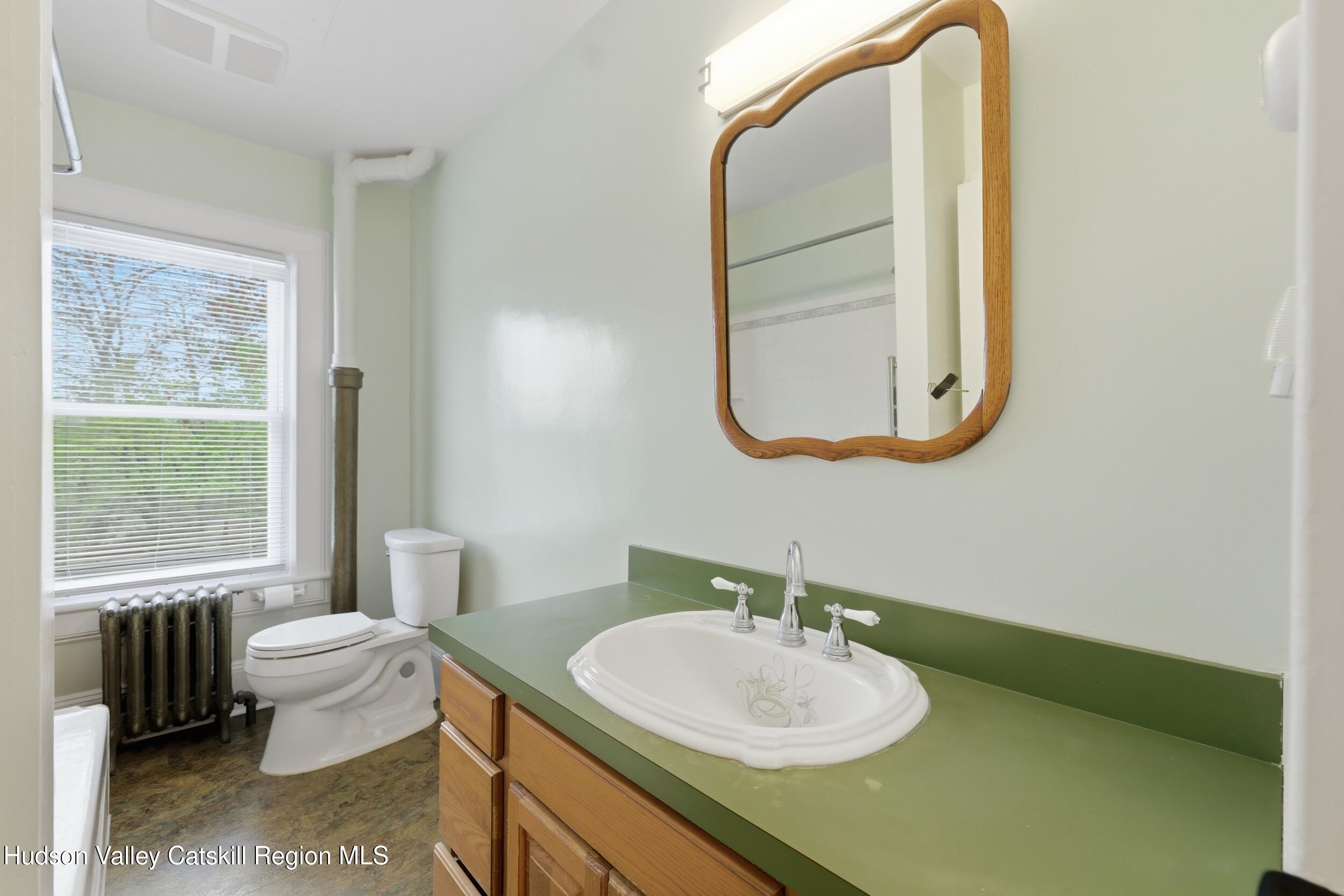 294 Kyserike Road Accord, NY 12404 - Photo 18 of 46 a bathroom with a sink a toilet and a mirror