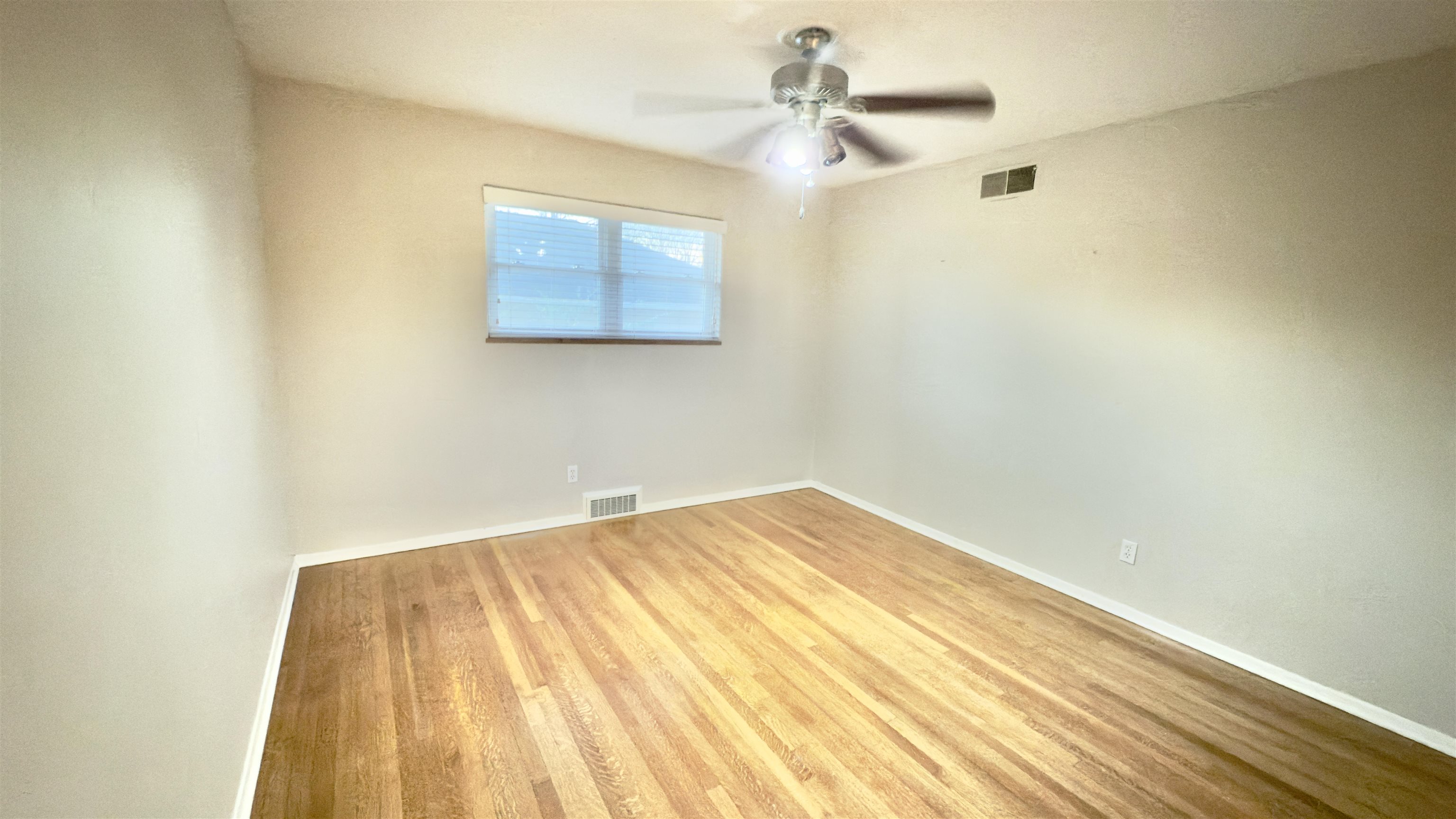 5209 Walnut Grove Road Memphis, TN 38117 - Photo 21 of 30 a view of a room with a wooden floor