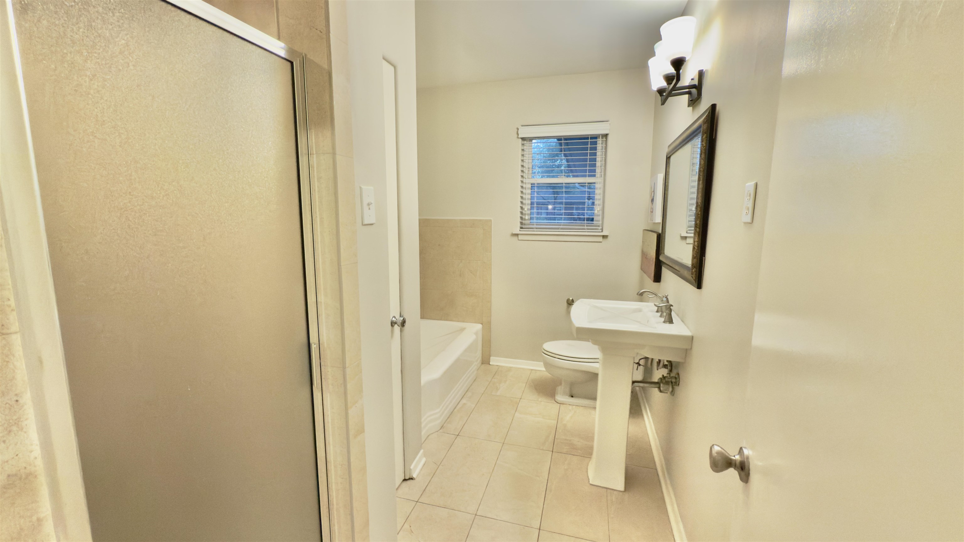 5209 Walnut Grove Road Memphis, TN 38117 - Photo 22 of 30 a bathroom with a sink and mirror