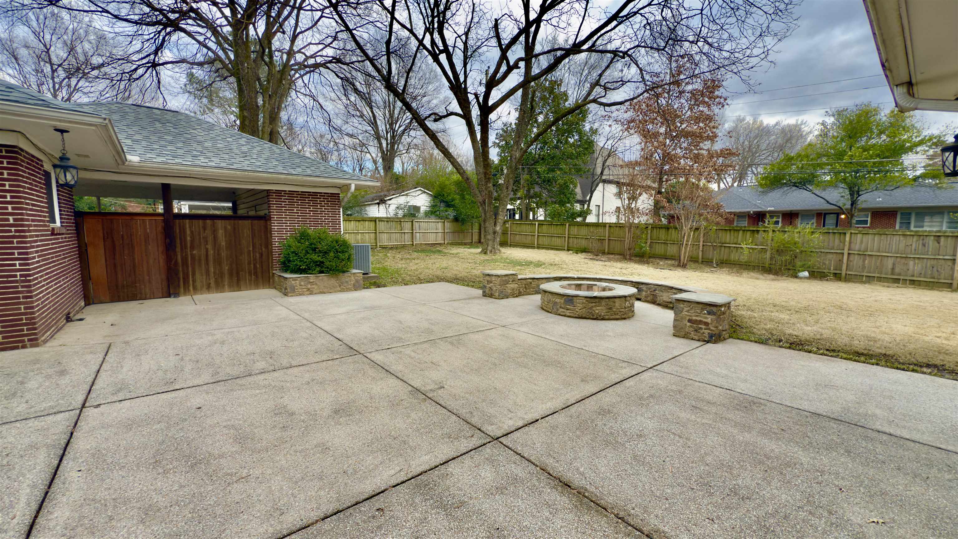 5209 Walnut Grove Road Memphis, TN 38117 - Photo 26 of 30 Fenced backyard featuring an outdoor fire pit and a patio area
