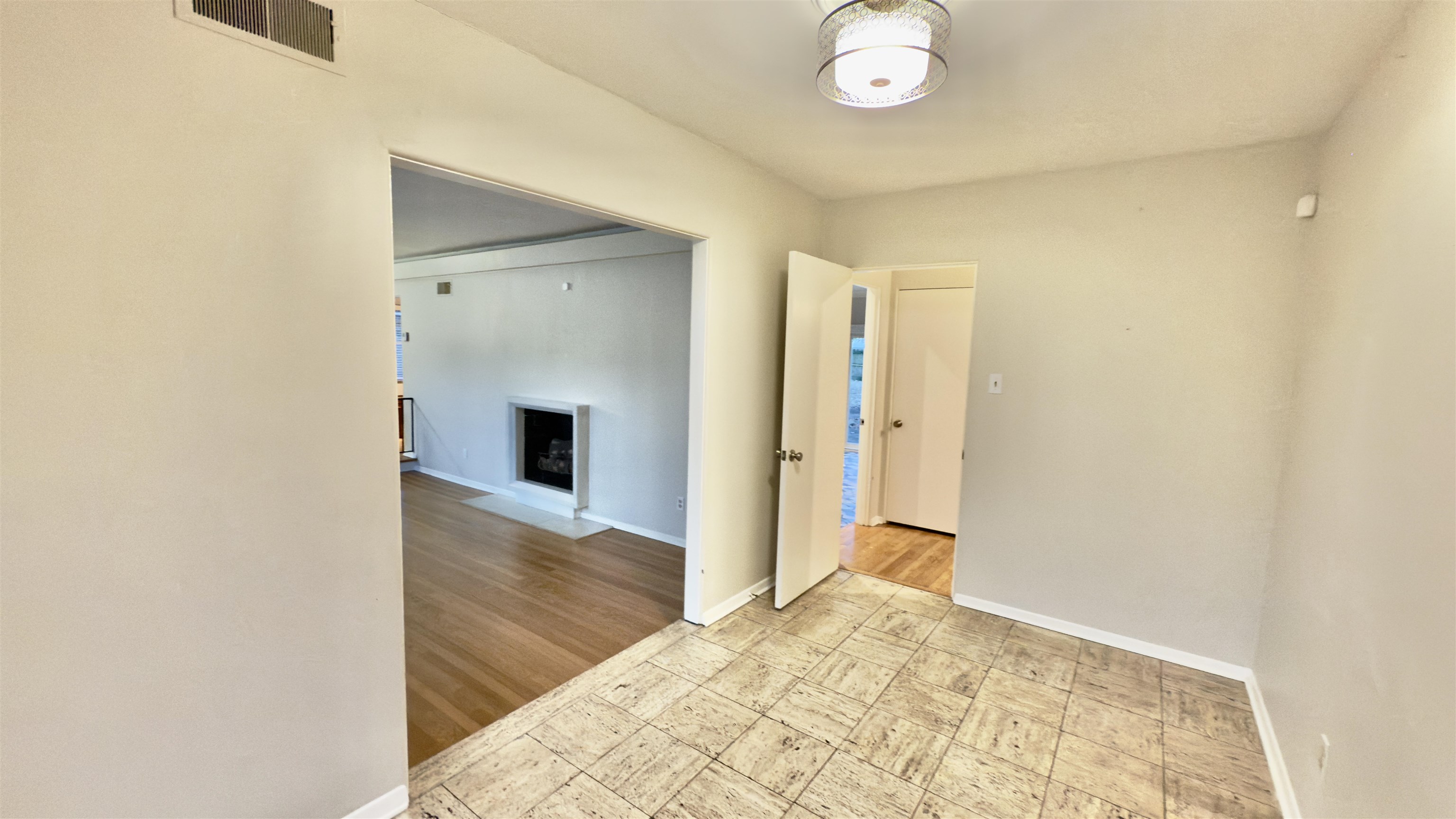 5209 Walnut Grove Road Memphis, TN 38117 - Photo 8 of 30 a view of a hallway with wooden floor and a bathroom