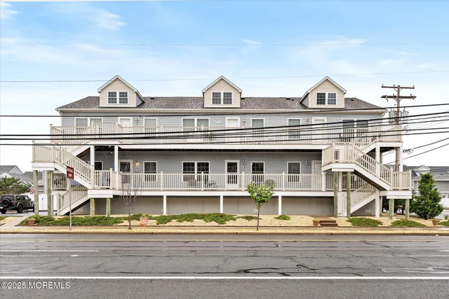 a view of a white building among the street