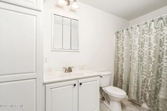 a bedroom with bed and a window