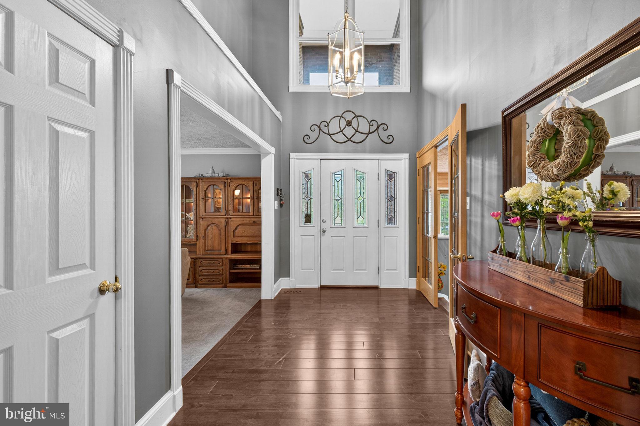 63 Rutherford Circle Sterling, VA 20165 - Photo 4 of 52 Foyer with gleaming wood floors & soaring ceilings