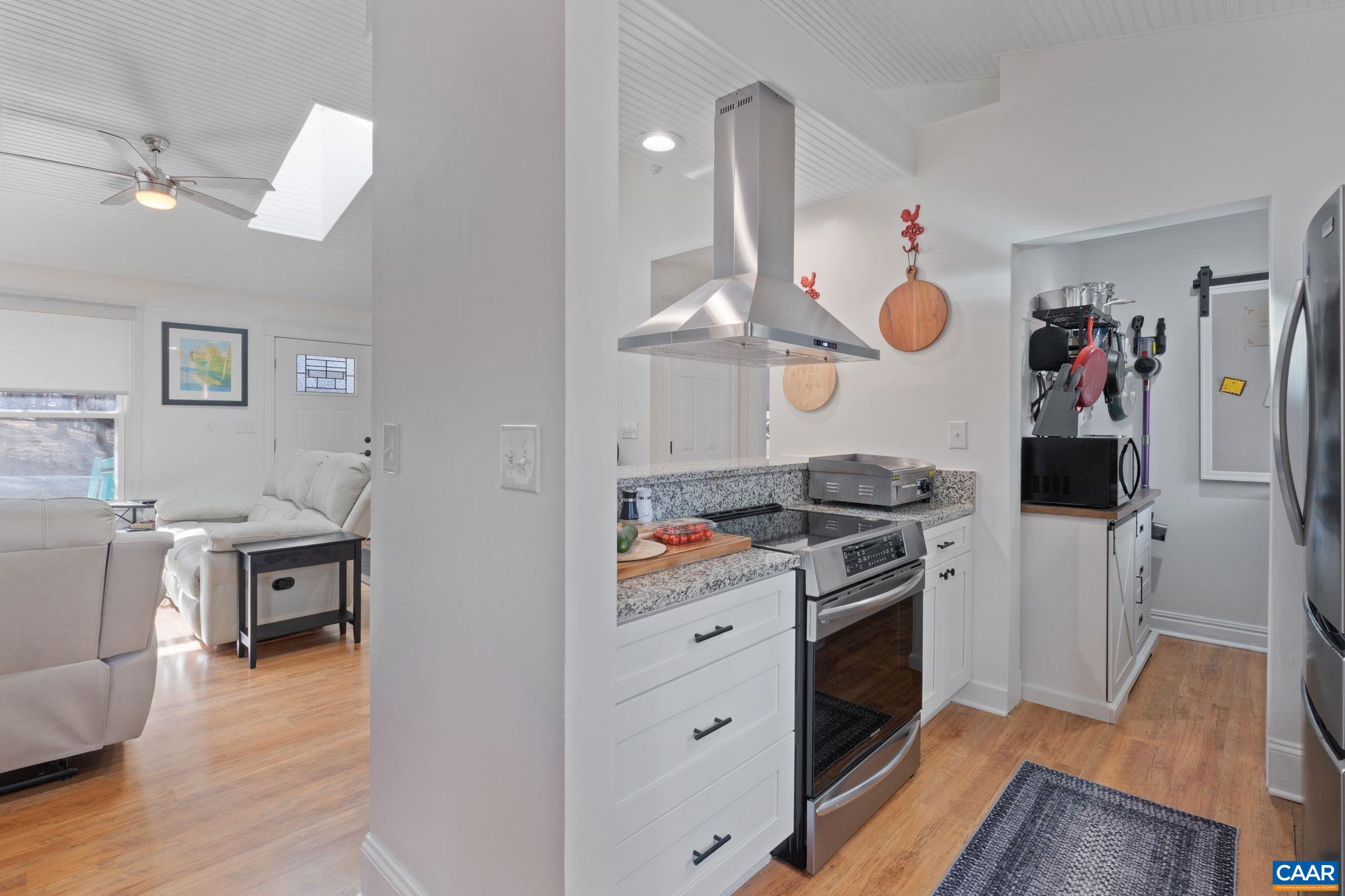 1 Hatchechubee Road Palmyra, VA 22963 - Photo 12 of 48 a kitchen with stainless steel appliances granite countertop a stove and a wooden floors