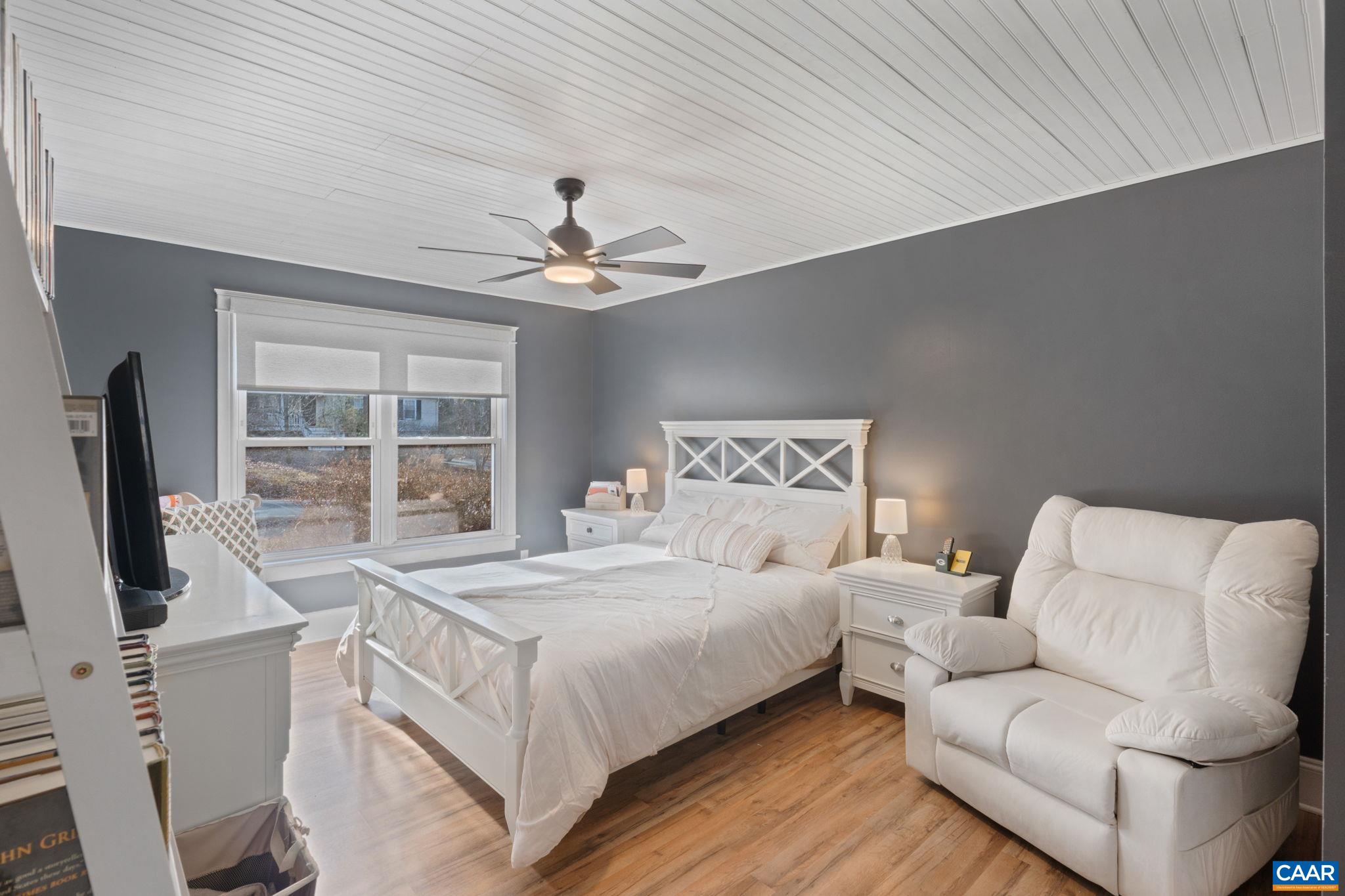 1 Hatchechubee Road Palmyra, VA 22963 - Photo 20 of 48 a bedroom with a large bed a flat screen tv and a large window