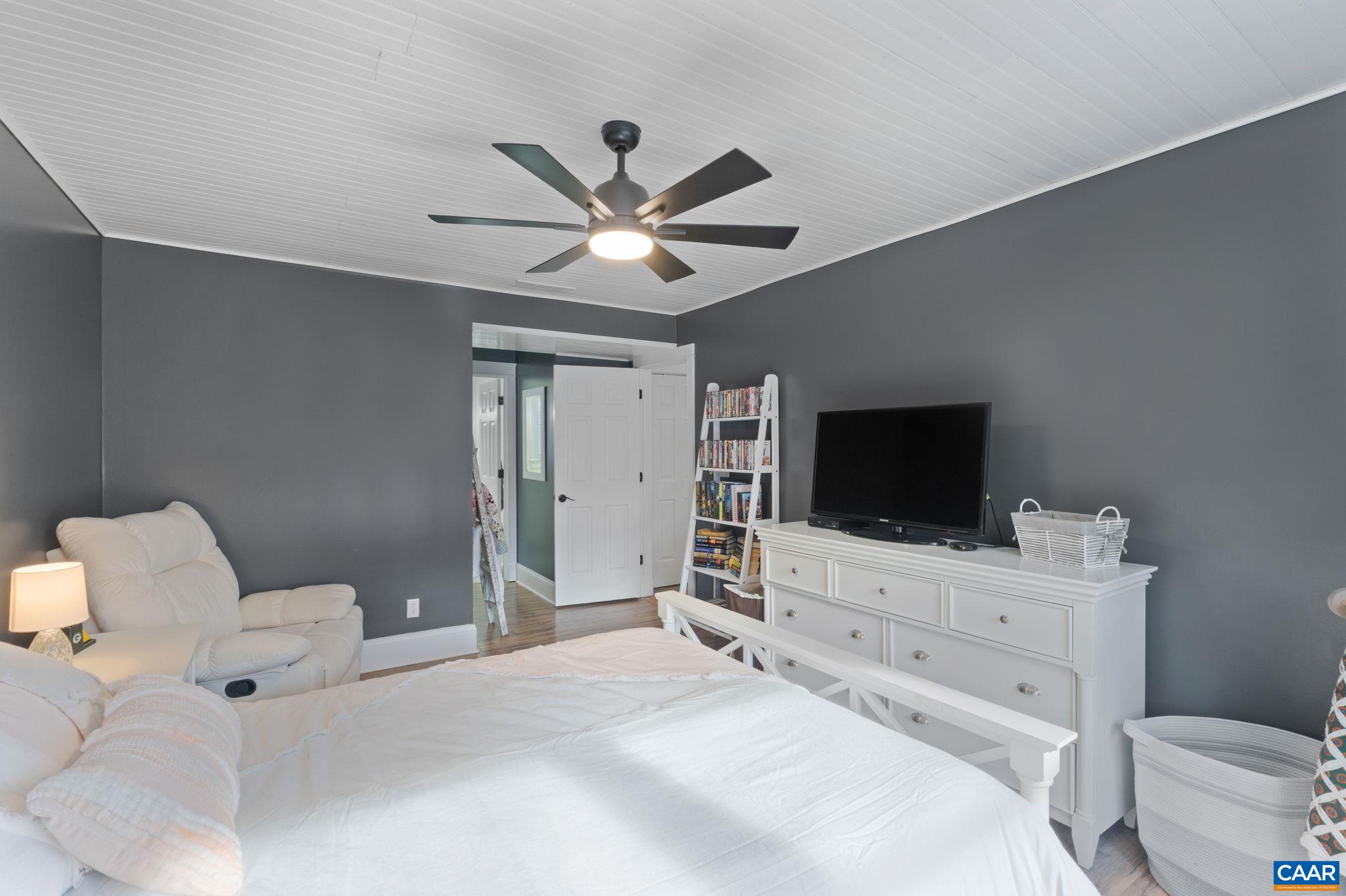 1 Hatchechubee Road Palmyra, VA 22963 - Photo 21 of 48 a bedroom with a bed and a flat screen tv