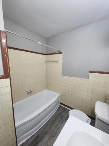 a bathroom with a sink and shower