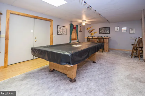 a bedroom with furniture and a wooden floor