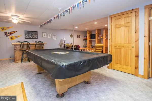 a bedroom with furniture and a gym equipment