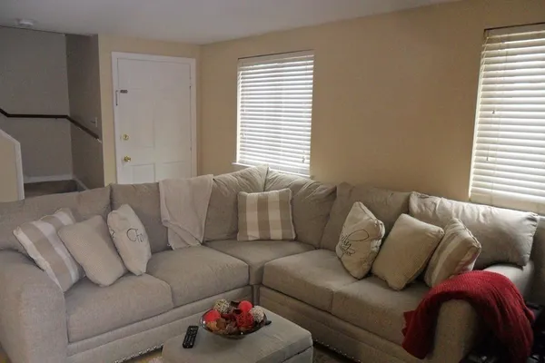 a living room with furniture and a large window
