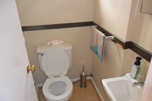 a bathroom with a toilet and a sink