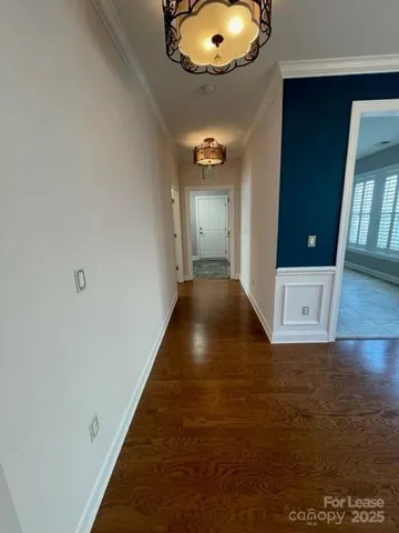 wooden floor in a hall with a window