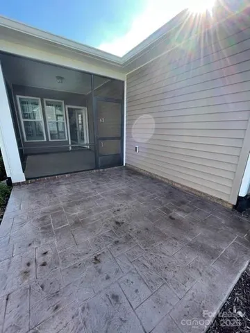 a view of front door and yard