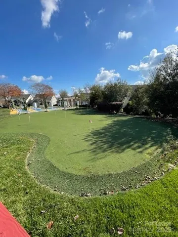 a view of a field with an ocean
