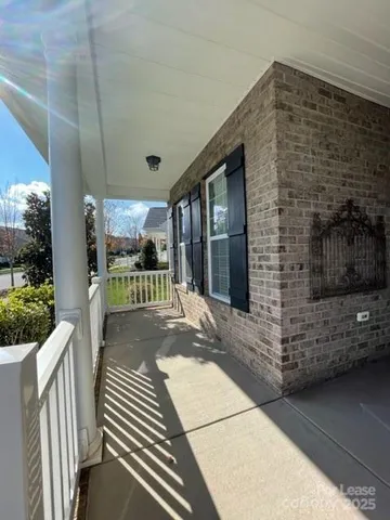 a front view of a house with a porch