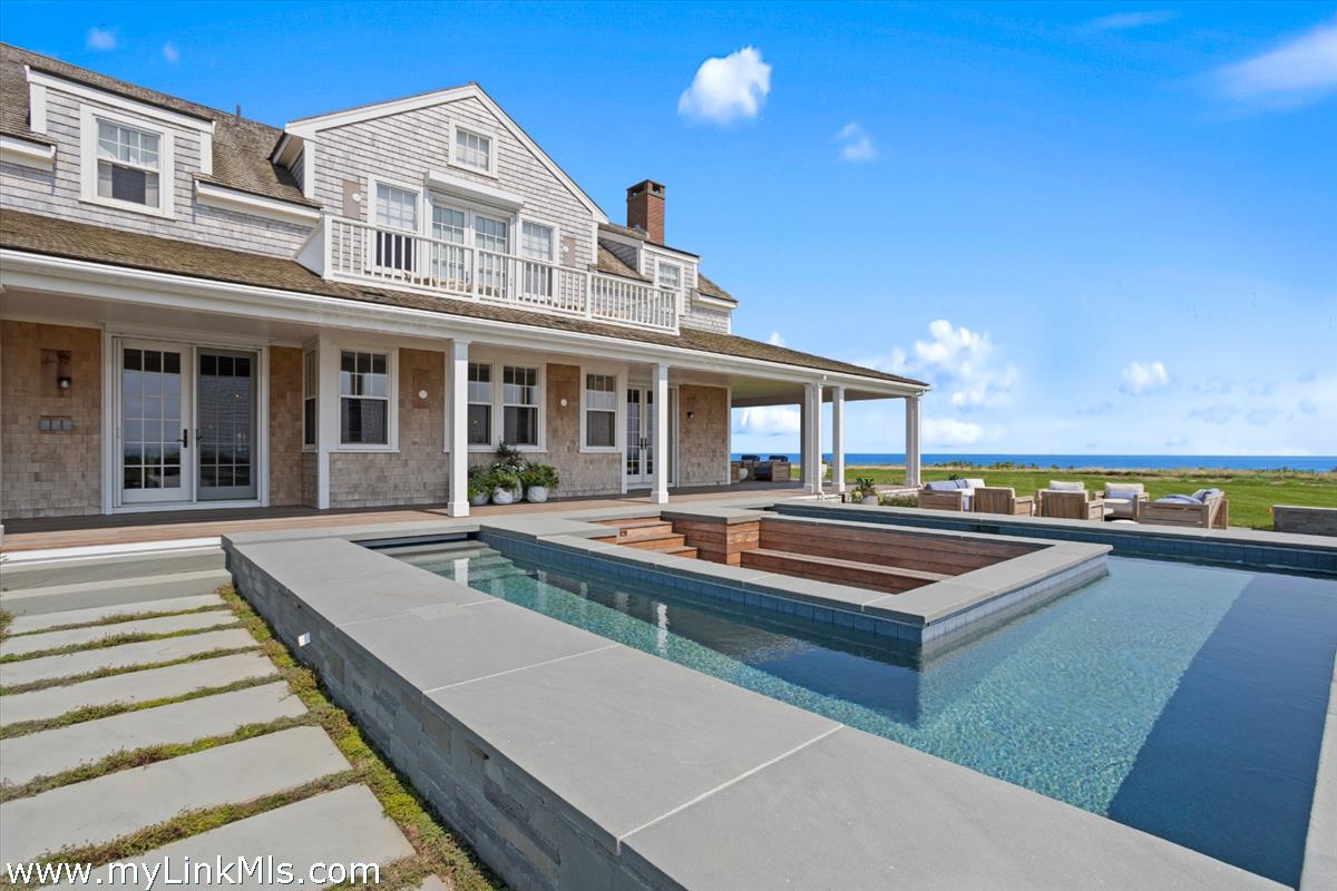 37 Sankaty Head Road Nantucket, MA 02554 - Photo 8 of 65 a view of a house with pool and chairs