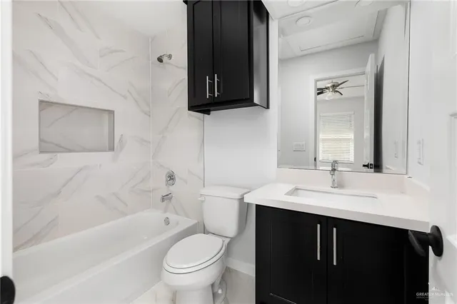 a bathroom with a sink a toilet and a bathtub