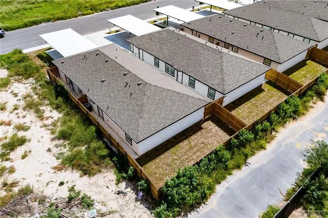 an aerial view of houses with a terrace