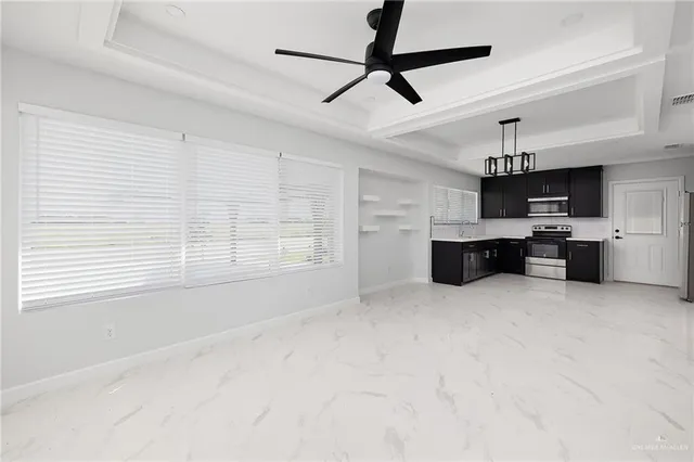 a view of a kitchen with a sink and a window