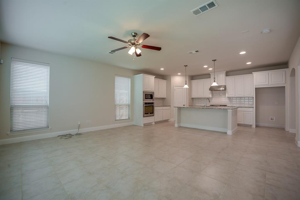 3412 Damsel Sauvage Lane Lewisville, TX 75056 - Photo 28 of 28 a view of an empty room with kitchen view and a window