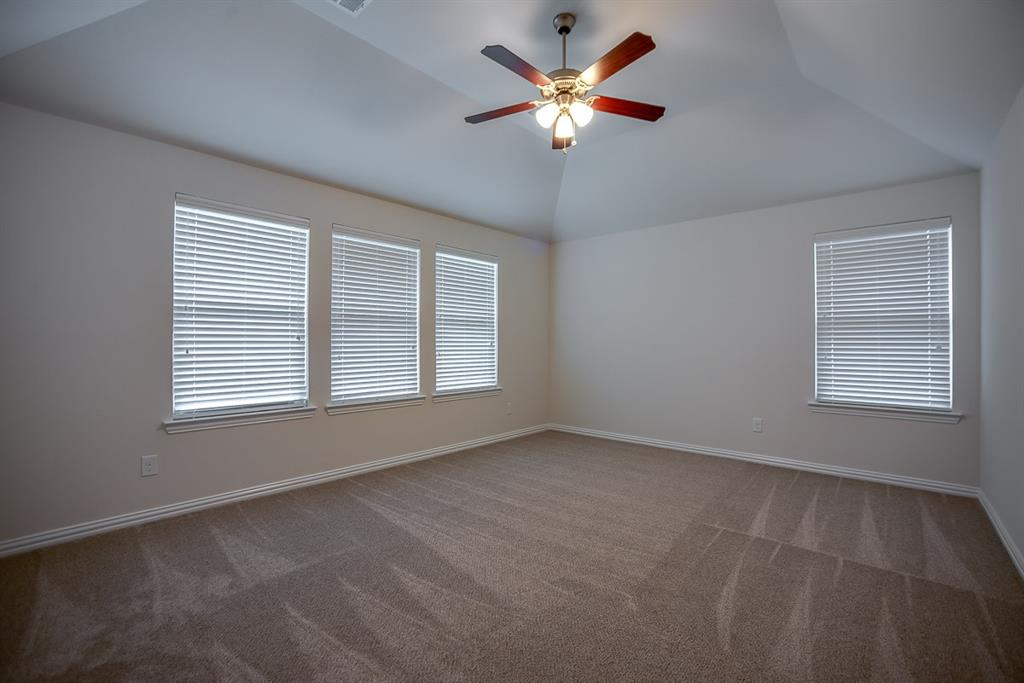 3412 Damsel Sauvage Lane Lewisville, TX 75056 - Photo 21 of 28 an empty room with a window and a fan