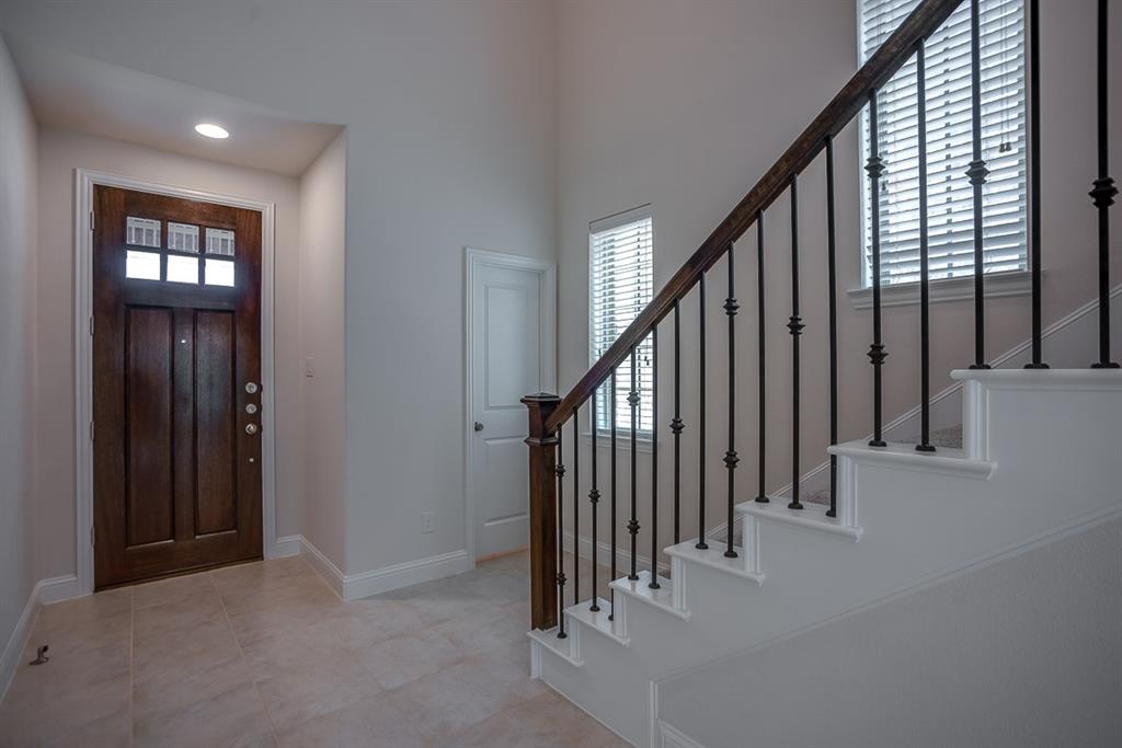 3412 Damsel Sauvage Lane Lewisville, TX 75056 - Photo 5 of 28 a view of an entryway with staircase
