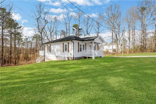 a view of a house with a big yard