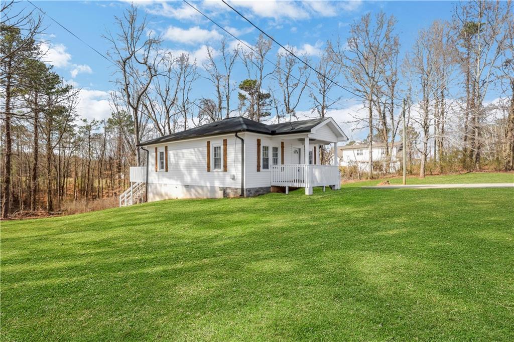 a view of a house with a big yard