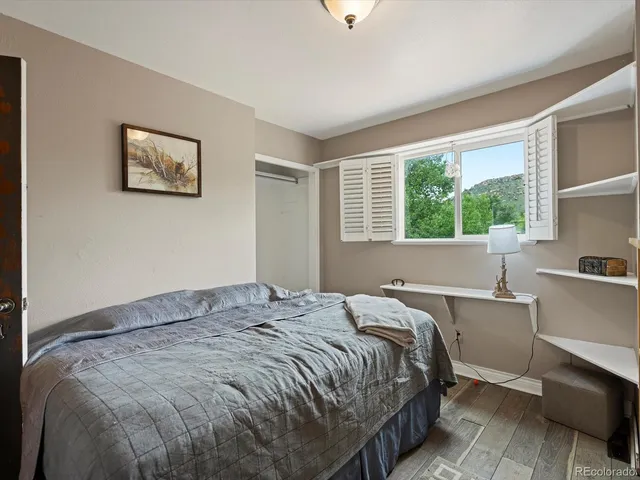 a view of a room with a large window and a yard