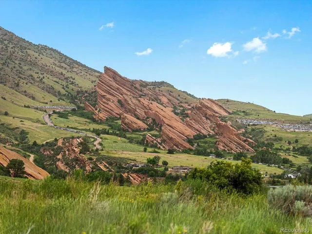 a view of a large body of water with a building in the background