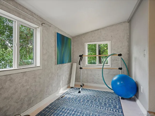 a view of workspace with a window and couch