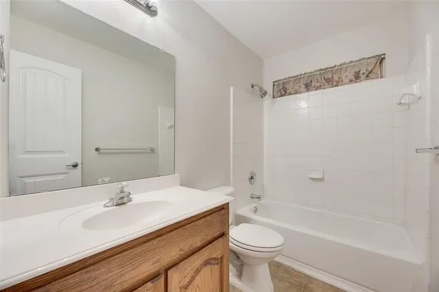 a bathroom with a sink a toilet and a bathtub