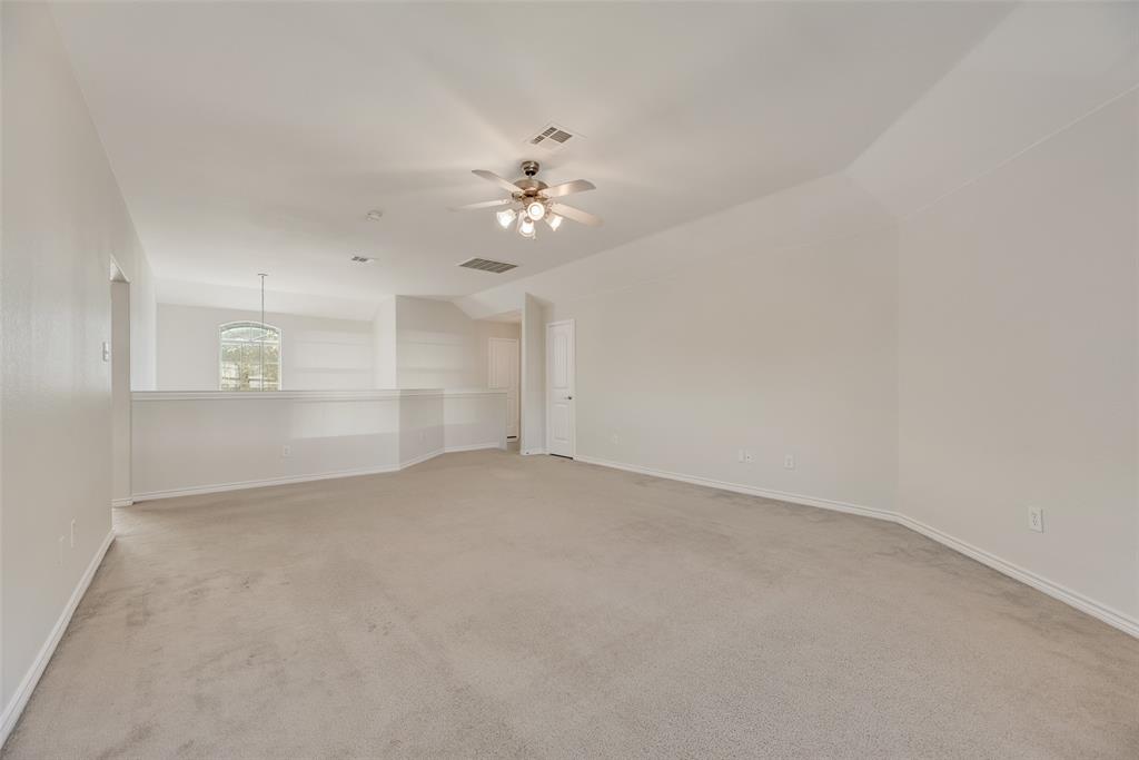 8004 Laughing Waters Trail McKinney, TX 75070 - Photo 17 of 24 a view of empty room with a ceiling fan