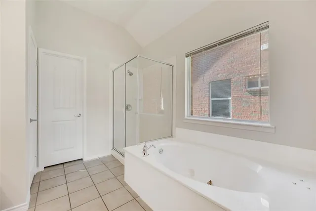 a white bath tub sitting next to a window