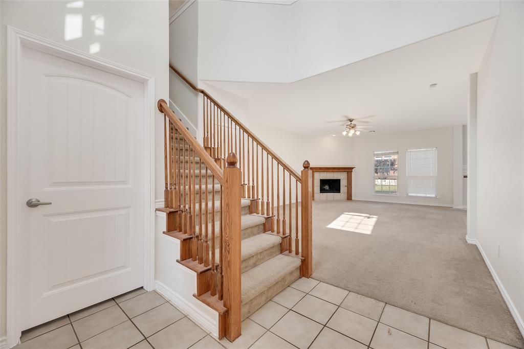 8004 Laughing Waters Trail McKinney, TX 75070 - Photo 3 of 24 a view of a livingroom with entryway and stairs