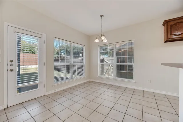 a view of an empty room with windows